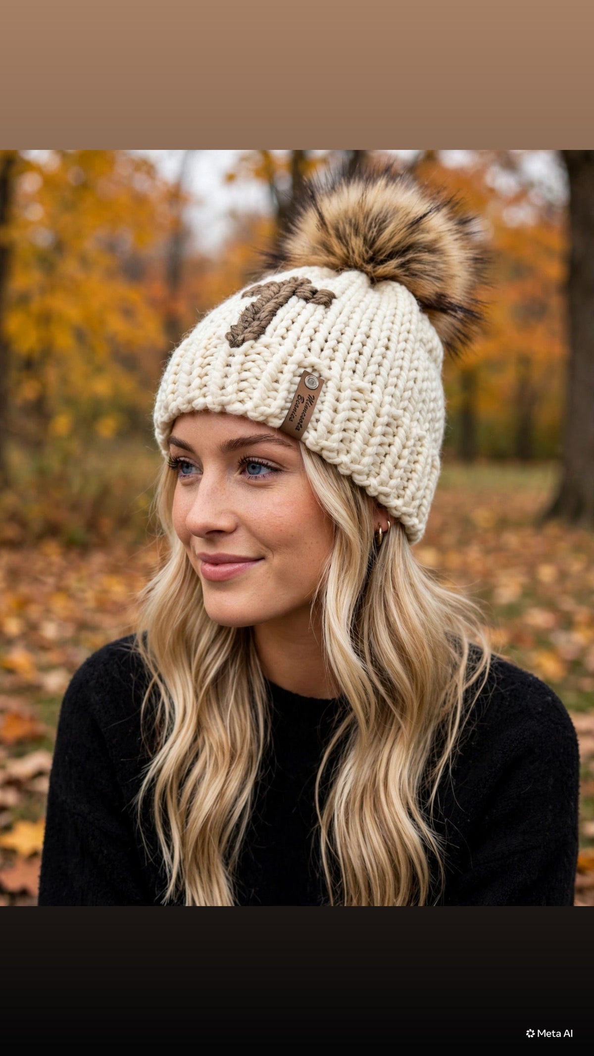 Northwoods Cross handmade cream and brown cross beanie with faux fur pom
