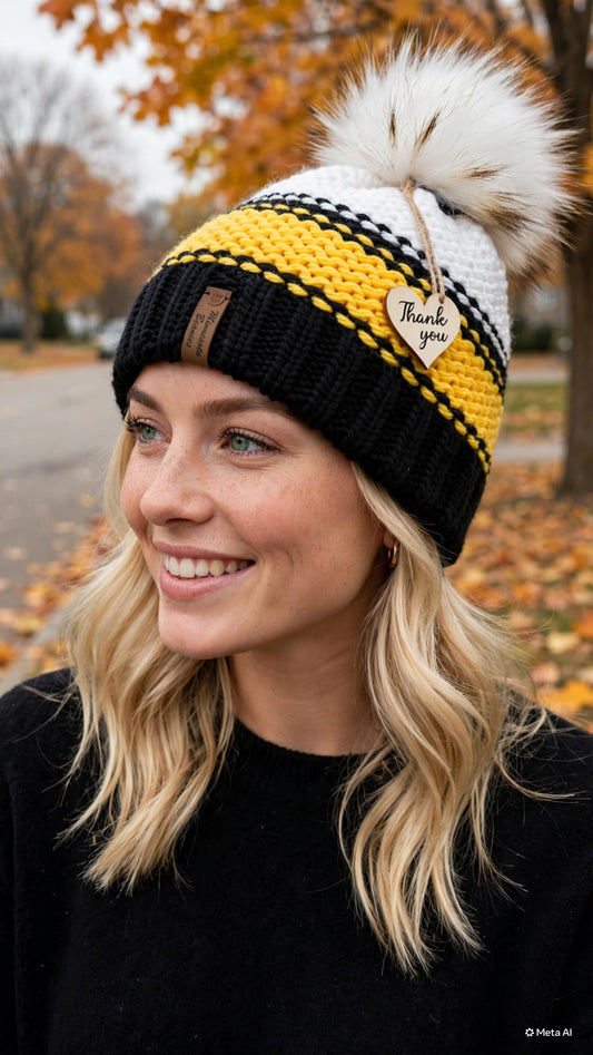 Golden North handmade black gold and white beanie with faux fur pom