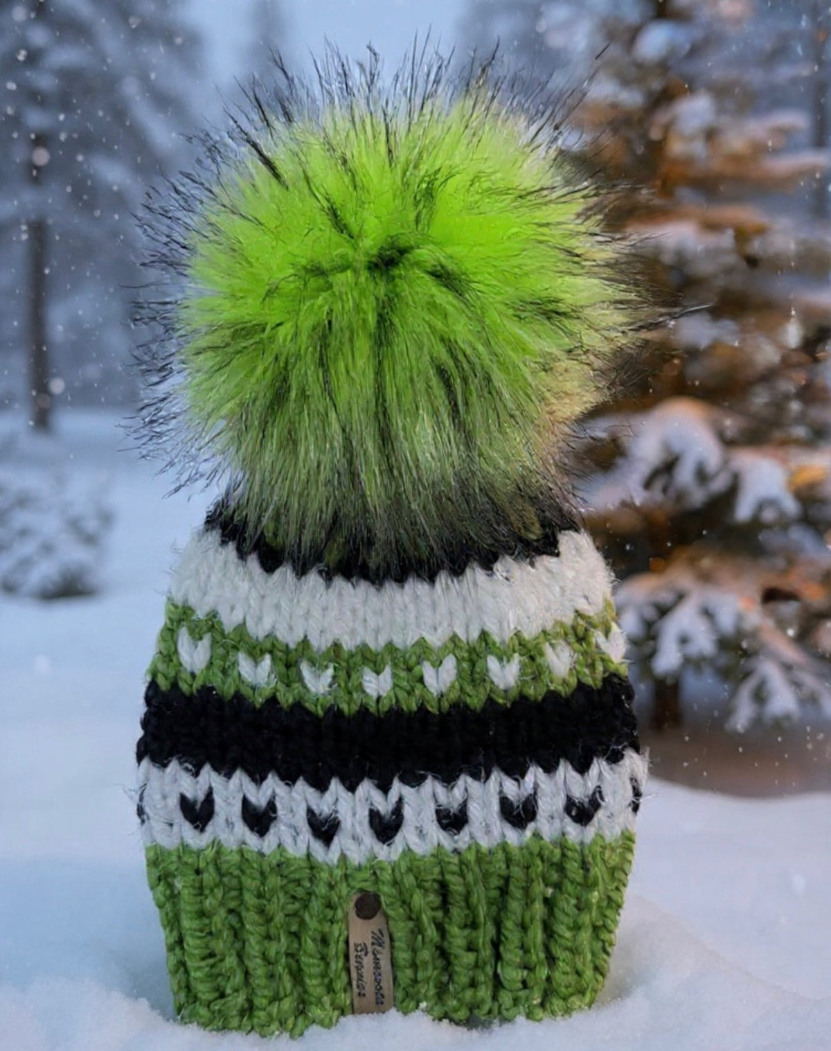 Northern Lights green black and white handmade beanie with green faux fur pom